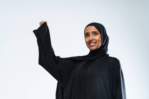 istock Beautiful arab middle-eastern woman with traditional abaya in studio 1494365827