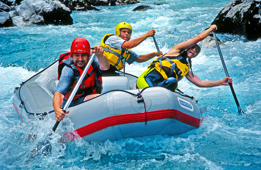 Raft in the canyon of the river Soca - White water rafting on the rapids of river Soca in Triglav national park, Slovenia. Soca is one of the most beautiful rivers of Europe.