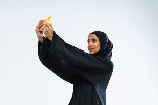 istock Beautiful arab middle-eastern woman with traditional abaya in studio 1494367059