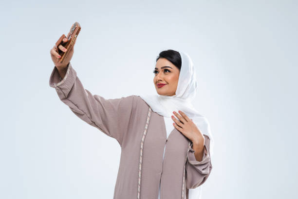 istock Beautiful arab middle-eastern woman with traditional abaya in studio 1494368100