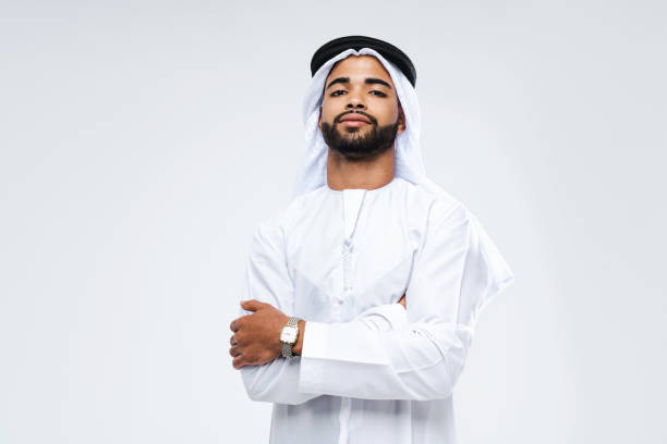 istock Handsome arab middle-eastern man with traditional kandora portrait in studio 1494368282