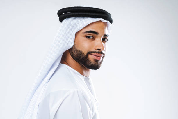 istock Handsome arab middle-eastern man with traditional kandora portrait in studio 1494368321