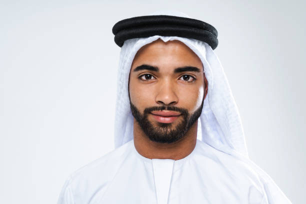 istock Handsome arab middle-eastern man with traditional kandora portrait in studio 1494368347
