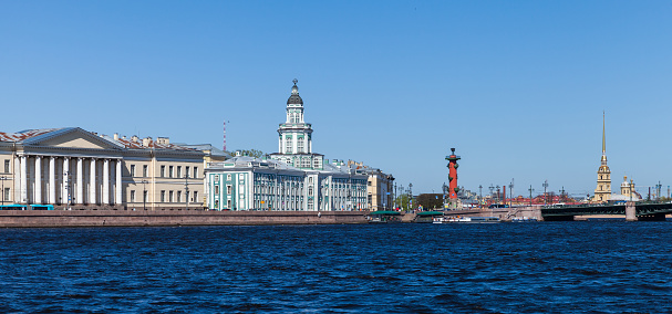 Neva river coast, St.Petersburg, Russia. Panoramic cityscape with Kunstkamera and Rostral column on a sunny summer day