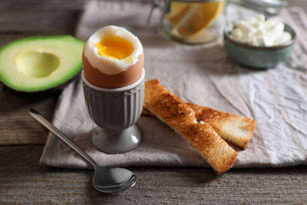 istock Soft boiled egg served for breakfast on wooden table 1494369283