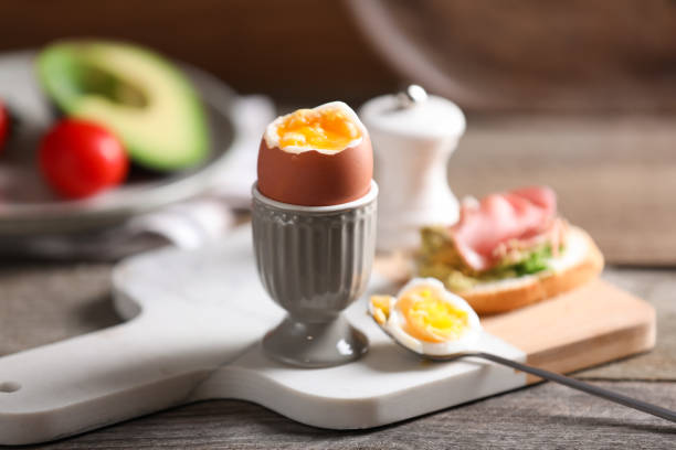 istock Soft boiled chicken egg served on wooden table 1494369306