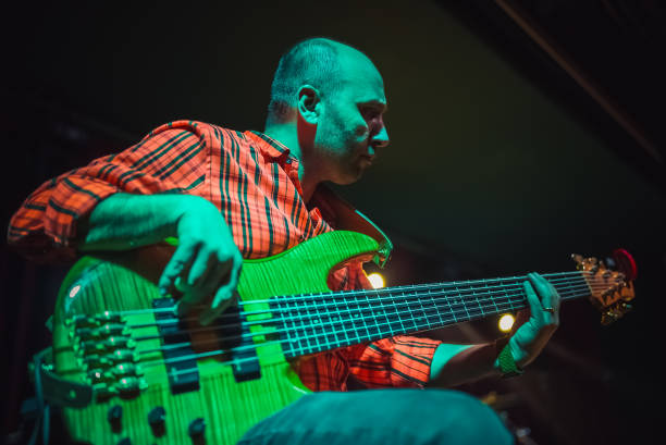 istock Musician playing bass guitar on stage 1494369970