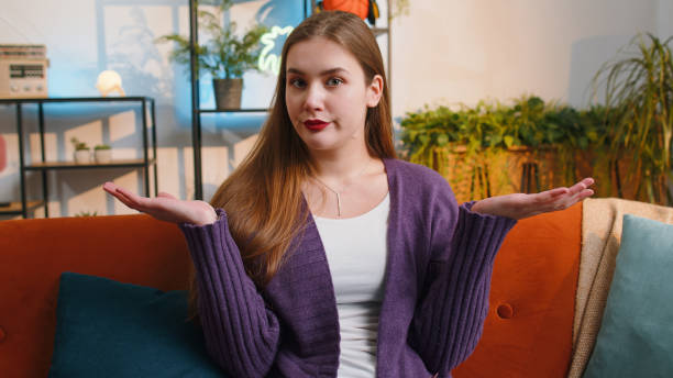 istock Confused young woman feeling embarrassed about ambiguous question, having doubts, no idea, no answer 1494371394