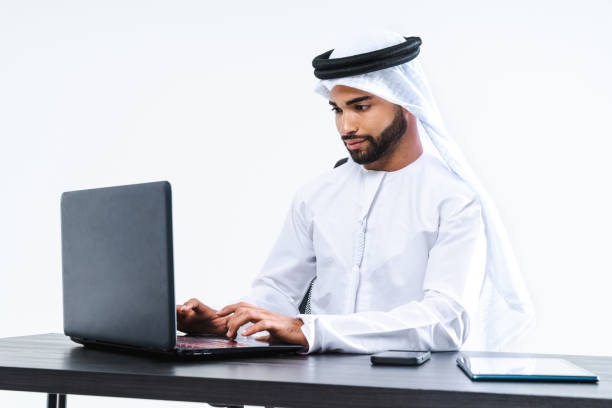 istock Emirate middle-eastern businessman wearing kandora working in the office, Dubai 1494371883