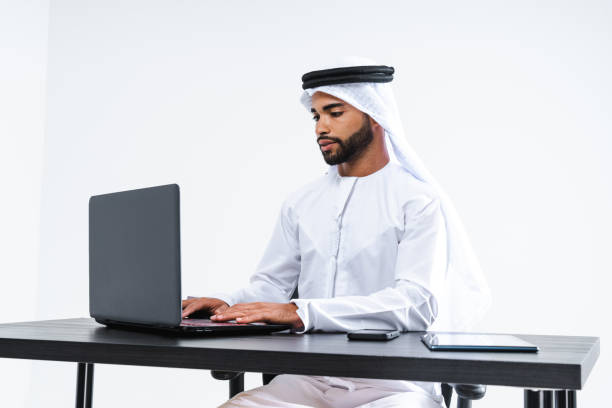 istock Emirate middle-eastern businessman wearing kandora working in the office, Dubai 1494372212
