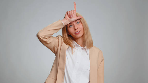 istock Business woman showing loser gesture blaming accusing for unsuccess, expressing disrespect, bullying 1494372711