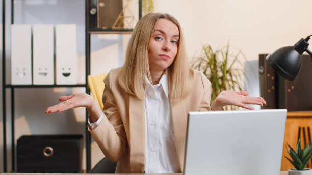 istock Confused businesswoman embarrassed about ambiguous question, having doubts, no answer idea, clueless 1494372731