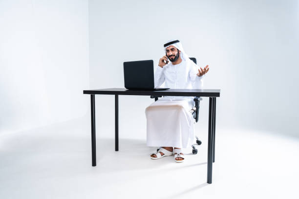 istock Emirate middle-eastern businessman wearing kandora working in the office, Dubai 1494373391