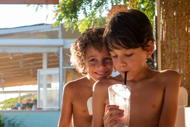 istock Brothers for milkshake cocktail on the beach 1494374559