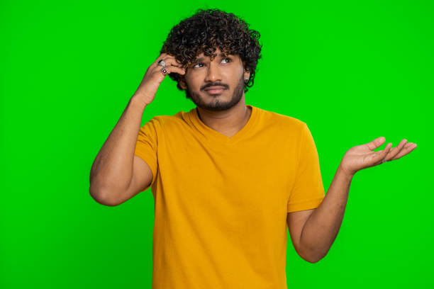 istock Puzzled clueless uncertain man raising hands in helpless, embarrassed confused by difficult question 1494374937