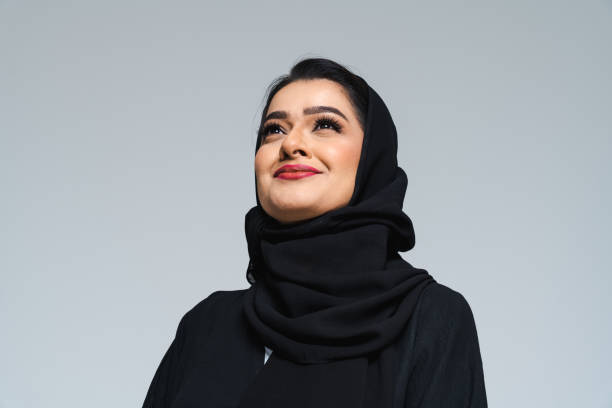 Beautiful arab middle-eastern woman with traditional abaya in studio