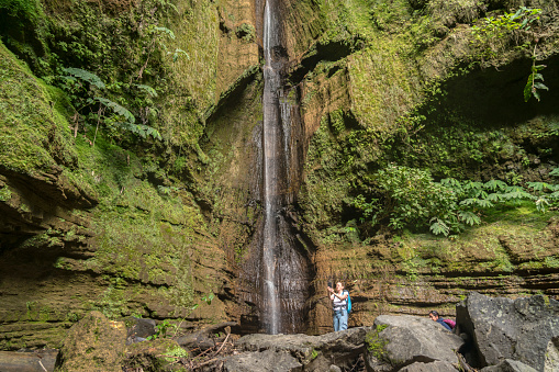 One women at Ribeira Quente Waterfall on São Miguel, the Azores