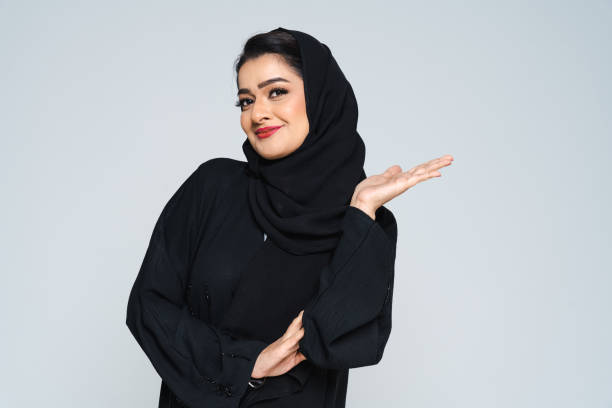 istock Beautiful arab middle-eastern woman with traditional abaya in studio 1494377095