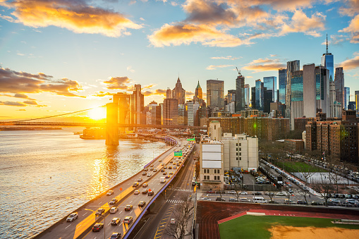 View on Brooklyn bridge and Manhattan at sunset, New York City