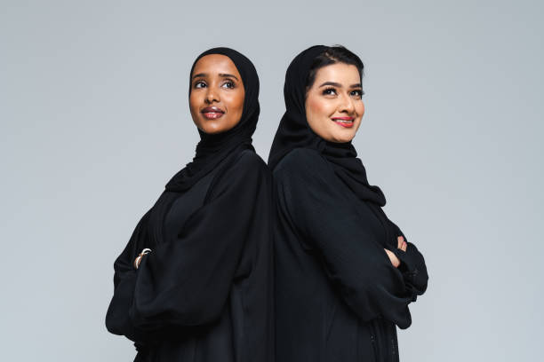 istock Beautiful arab middle-eastern women with traditional abaya in studio 1494377596