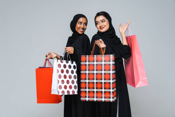 Beautiful arab middle-eastern women with traditional abaya in studio stock photo