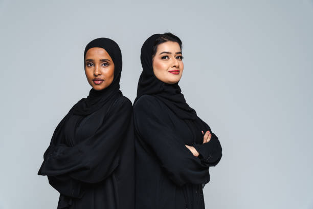 istock Beautiful arab middle-eastern women with traditional abaya in studio 1494377702
