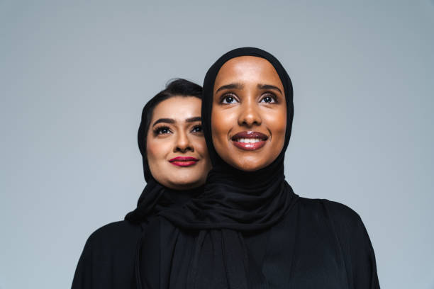 istock Beautiful arab middle-eastern women with traditional abaya in studio 1494377871
