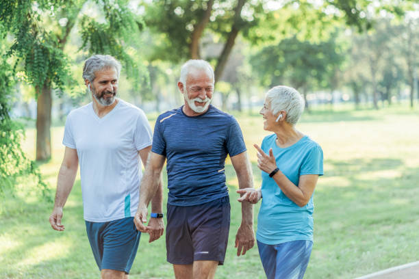 istock Three senior friends jogging together 1494379599