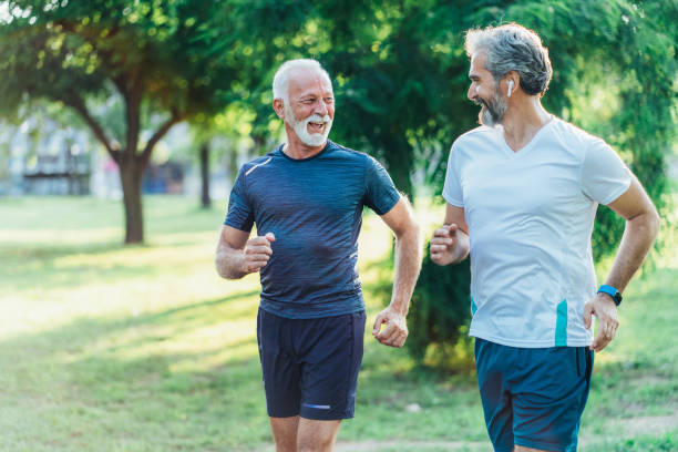 istock Senior friends jogging together 1494379600