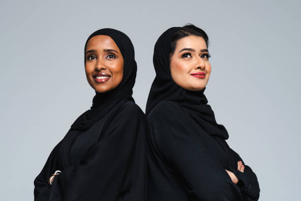 Beautiful arab middle-eastern women with traditional abaya in studio stock photo