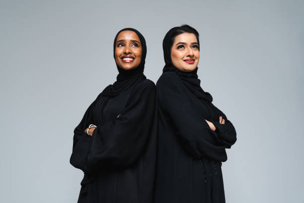 istock Beautiful arab middle-eastern women with traditional abaya in studio 1494379687