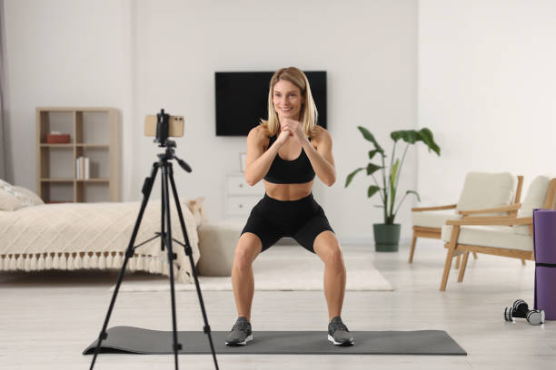 istock Fitness trainer recording online classes at home 1494380008