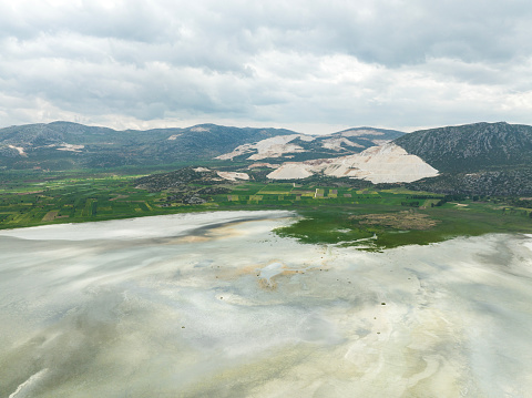 Aerial view of marble quarry by the lake. Burdur, Turkey. Taken via drone.
