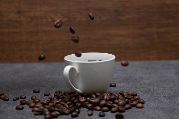 istock Coffee beans in a coffee cup on a gray stone background. 1494383560