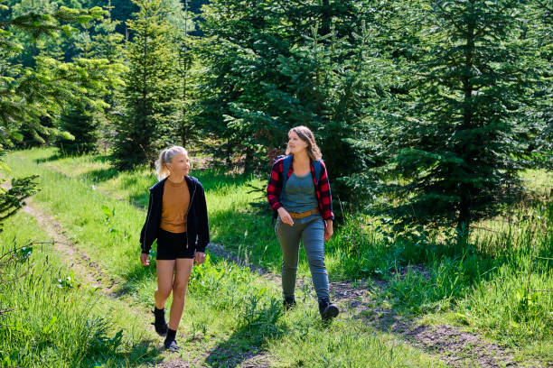 istock Mother and child walking on path 1494384074