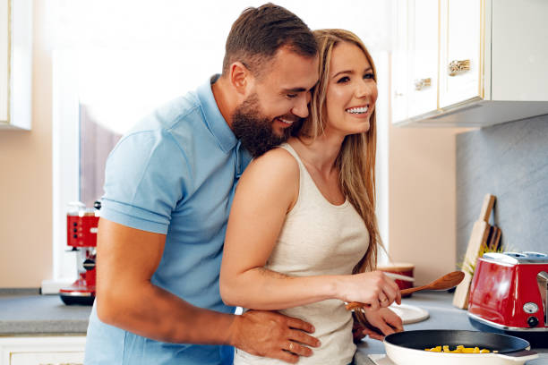 istock Young loving couple cooking together in kitchen 1494386629