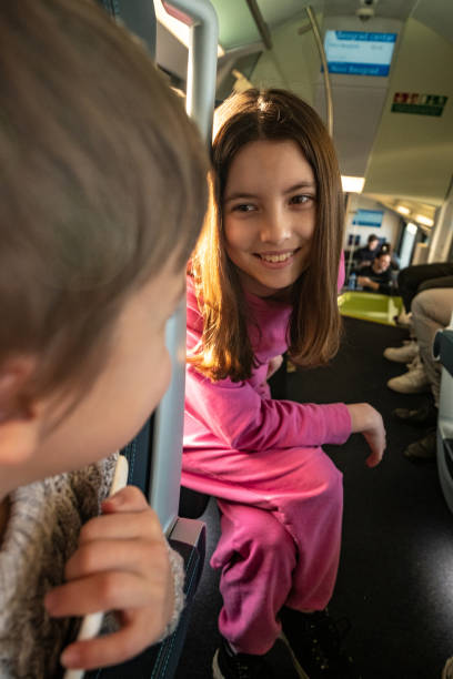 istock teenagers talk on the train 1494391540