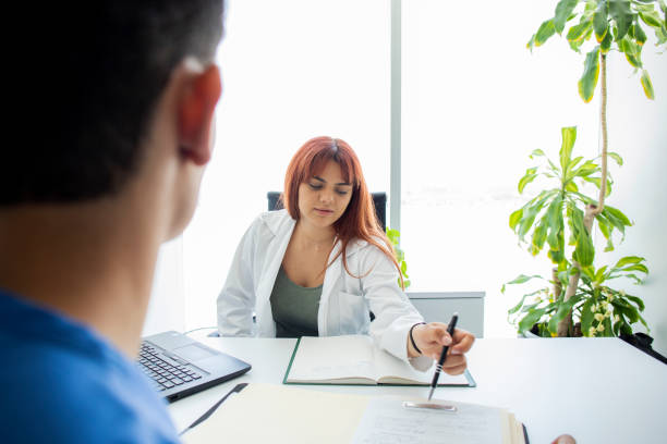 istock Doctor and nurse talking in the office 1494399702