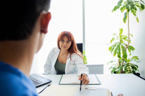 istock Doctor and nurse talking in the office 1494399705
