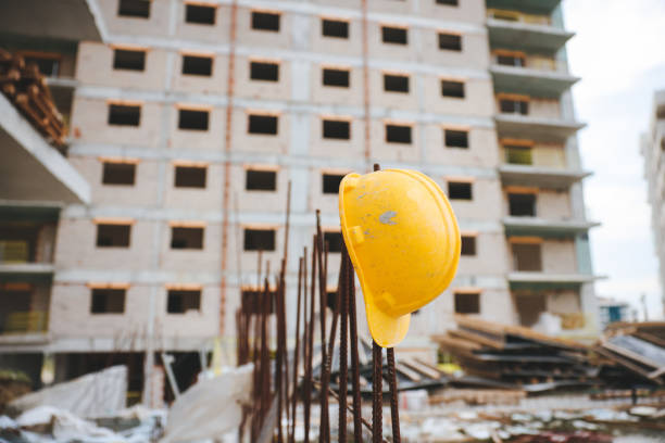 Protective helmet. Protective equipment. Construction safety equipment. Yellow safety helmet on wooden beams.