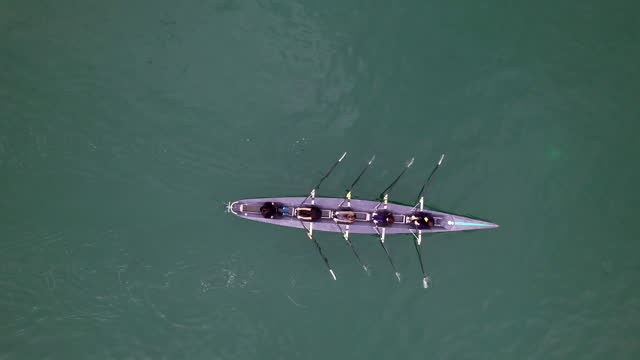 rowing sport with aerial drone, undefined crowd canoeing on weekend