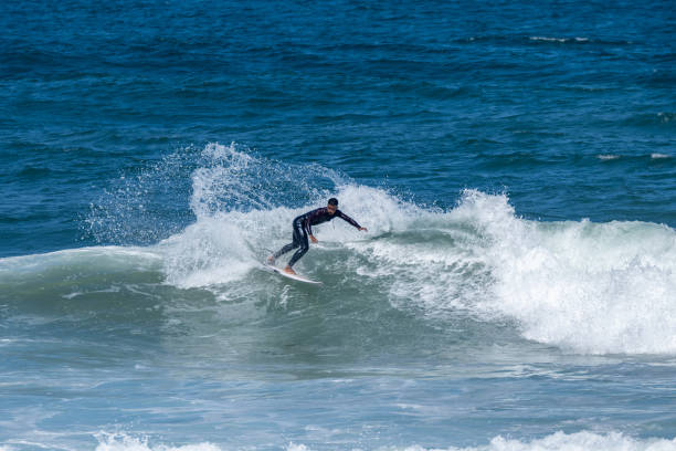 istock Surfer riding waves in Furadouro Beach 1494403768