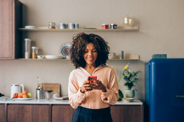A Happy Beautiful Businesswoman Using Her Mobile Phone