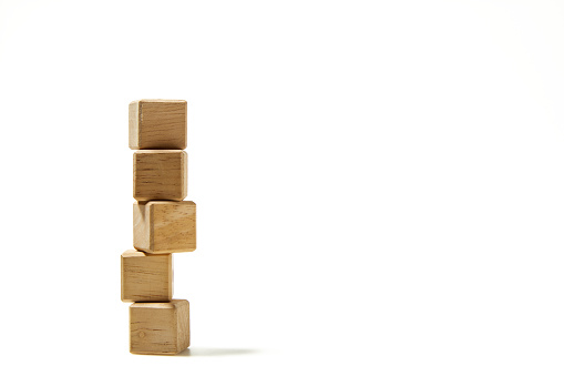 Five empty wooden cube blocks stack on white background with copy space, Mockup composition for design