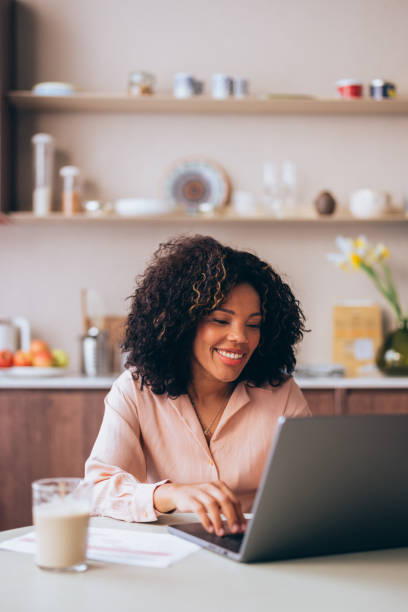 istock A Happy Beautiful Businesswoman Working From Home On Her Computer 1494406327