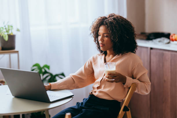 istock A Happy Beautiful Businesswoman Working From Home On Her Computer 1494406330