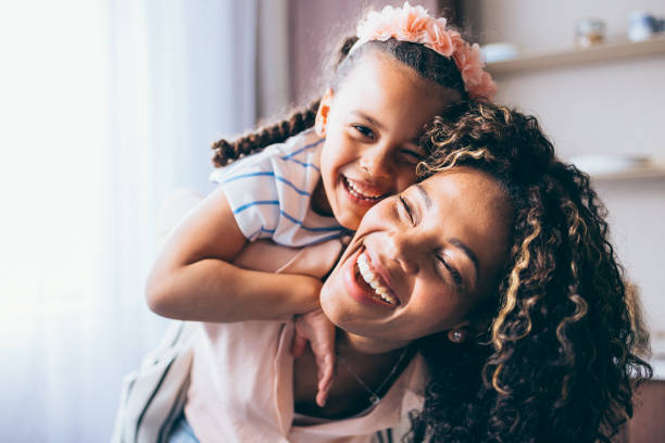 istock A Happy Beautiful Child Looking At Camera While Playing With Her Mother 1494406598