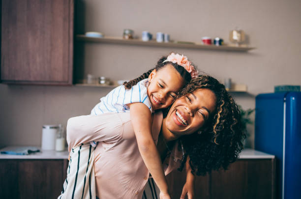 istock A Happy Beautiful Woman Looking At Camera While Playing With Her Cute Child 1494406603