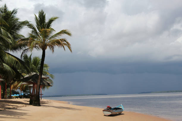 A lone boat rests on the sands of a river beach on the island of Cotijuba, Belém, state of Pará, northern Brazil.