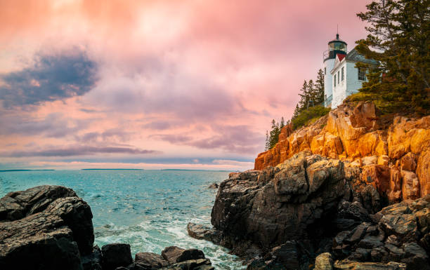 istock Sunset over the lighthouse on the cliff 1494414990